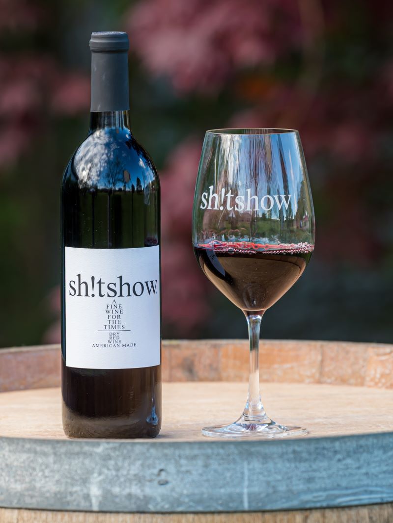 A bottle and glass of Grovedale's Sh!tshow wine