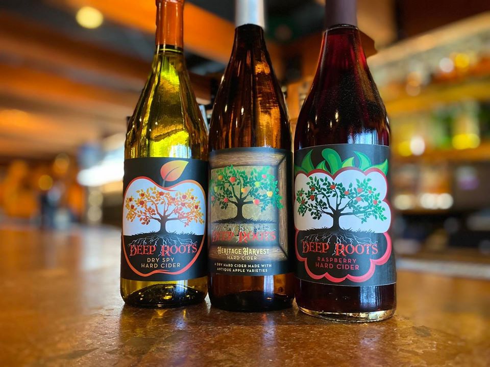 Three bottles of hard cider from Deep Roots.