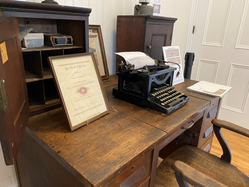 Antique desk with typewriter and artifacts
