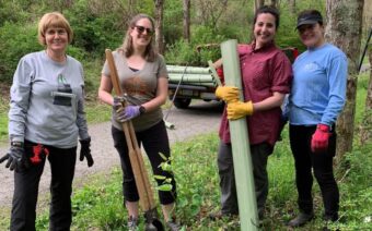 Four volunteers prepare to work on Countryside Conservancy's trails