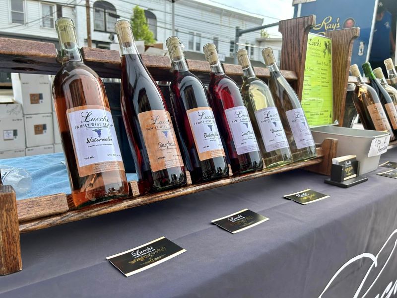 A line of wine bottles on display at the Montrose Wine Walk