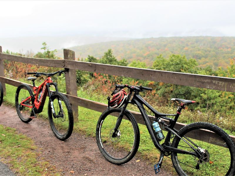 Gravel bikes lean against a fence at High Knob Overlook