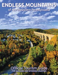 Cover of the Endless Mountains Visitors Guide featuring an aerial photo of the Tunkhannock Creek Viaduct, a railroad bridge in Nicholson, PA