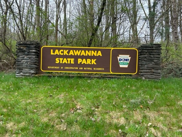 Brown and yellow sign at the entrance of Lackawanna State Park